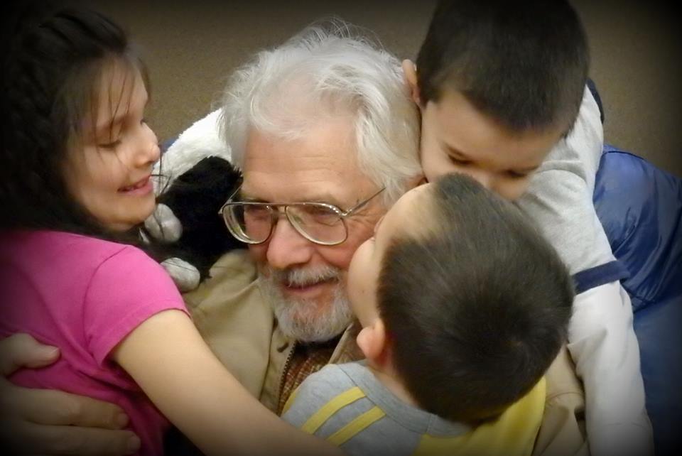 Stanley children hugging on their dad