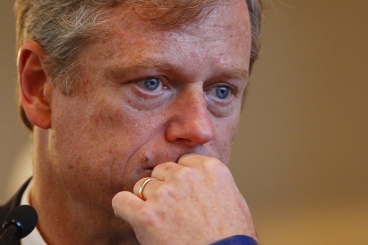 BOSTON - SEPTEMBER 24: Candidate for Governor Charlie Baker watches a question on a video monitor during a debate focused on human services at Faneuil Hall in Boston, Massachusetts September 24, 2014. (Photo by Jessica Rinaldi/The Boston Globe via Getty Images)