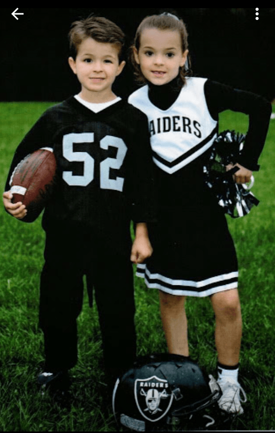 Tatianna and John in football and cheer outfits