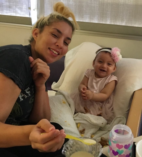 Aniya smiling with mom in hospital May 2