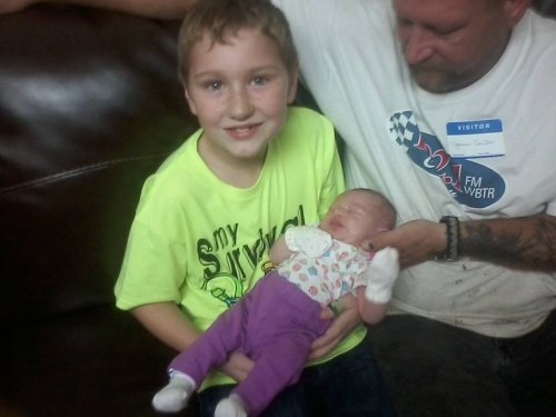 Cartee-Timothy-Cartee-holding-KahLyn-for-the-first-time-sept-23rd-2014