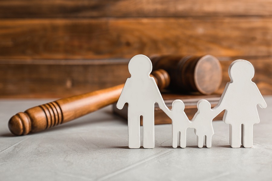 Family figure and gavel on table image